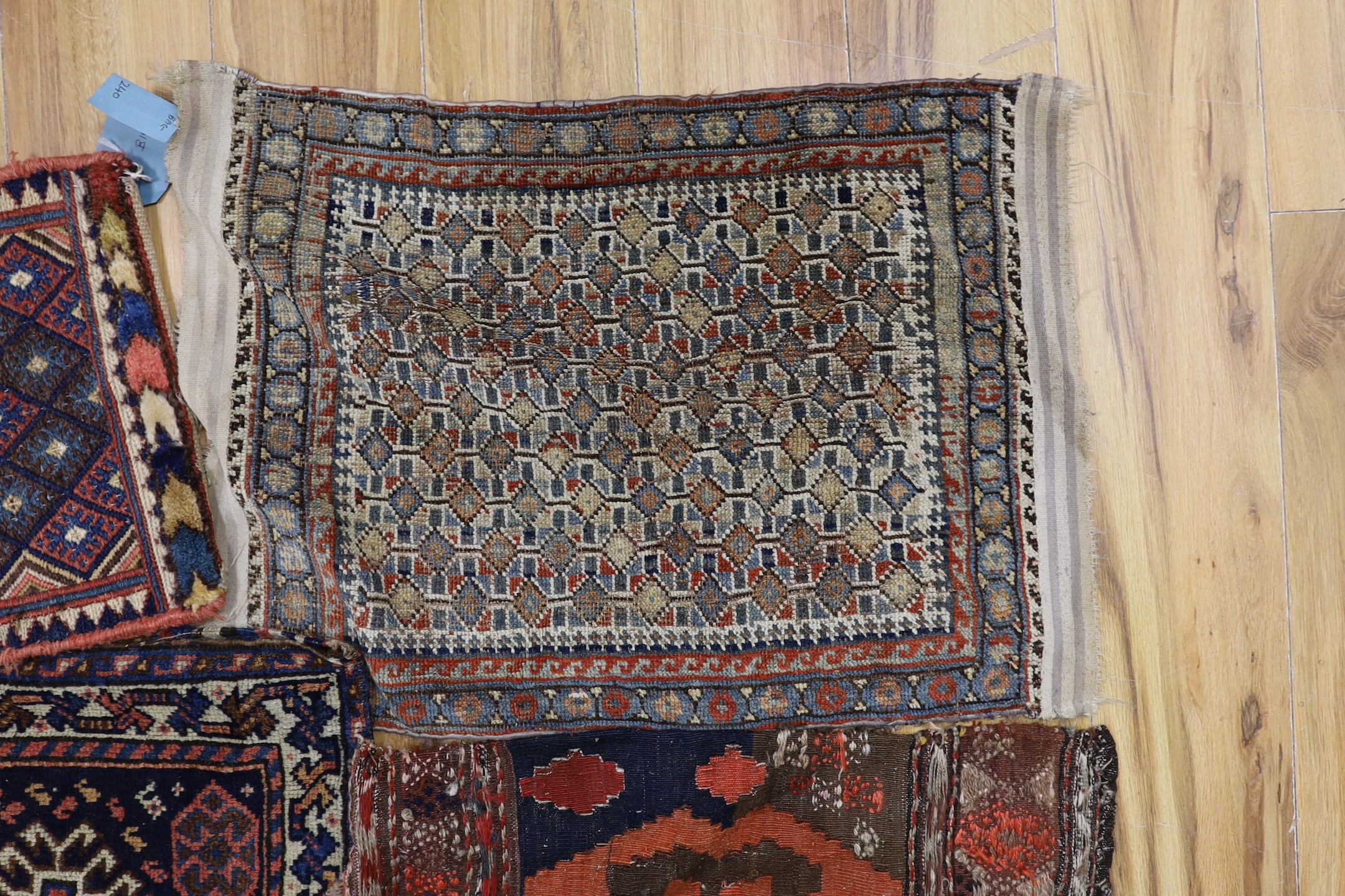 Two carpet saddlebags: Kasquai and a Shamdavan salt bag, a Kilim panel, a Soumac and a Tekke fragment
